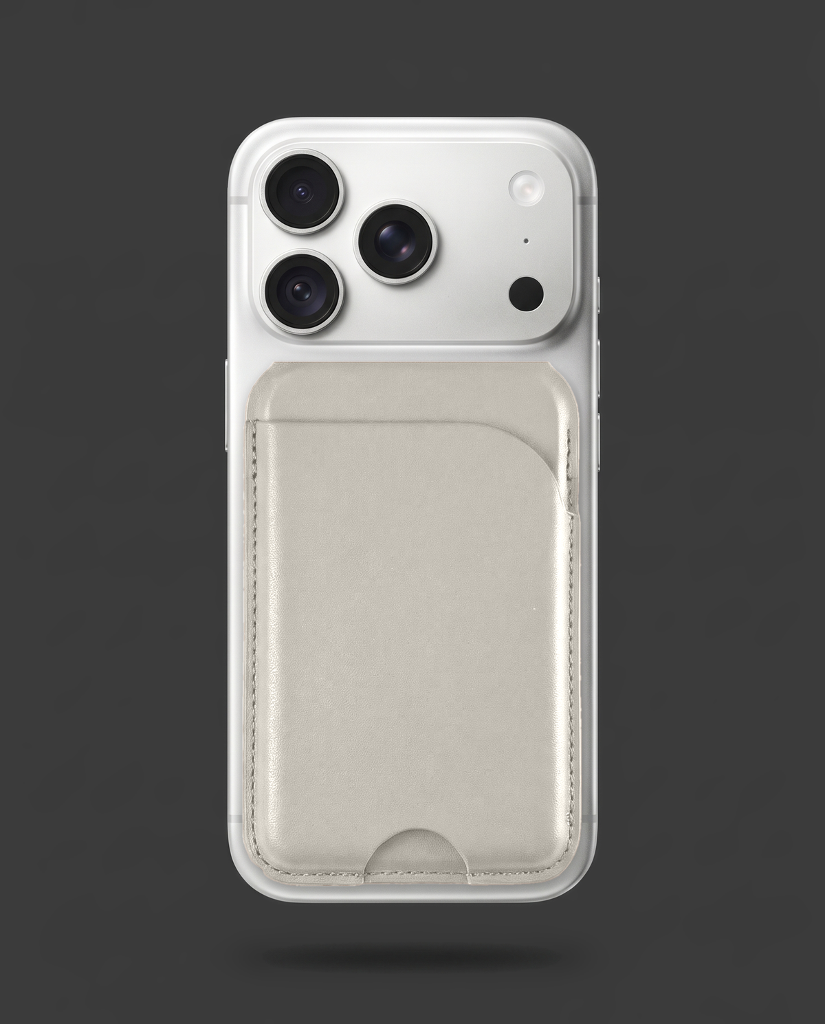 Grey card wallet on the back of an iPhone
